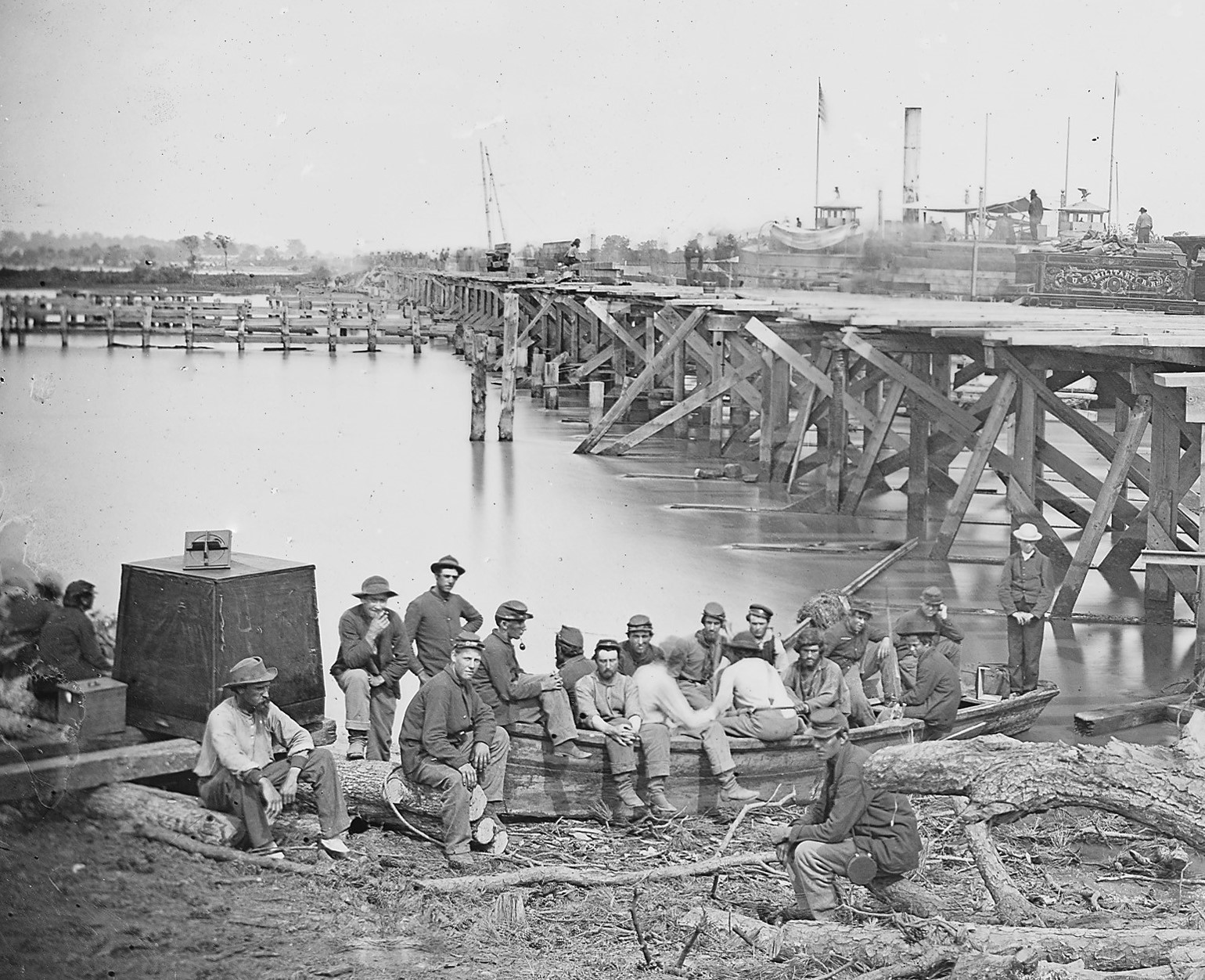 A detail from a Fowx photo at the railroad bridge at White House Landing shows Fowx’s square, black darkroom tent with his sequential lens device sitting on top.